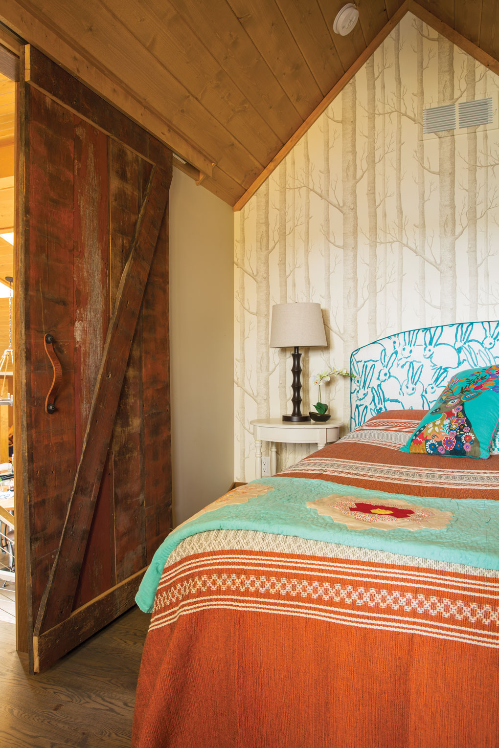 A loft bedroom featuring vintage items in a cabin in Luck, Wisconsin.