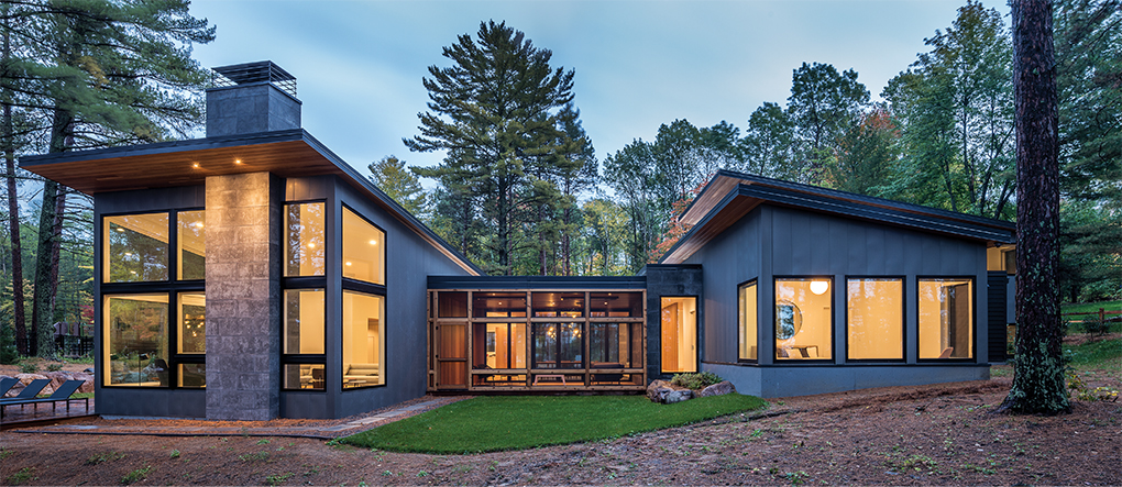 The exterior of a modern north woods home designed by Strand Design.
