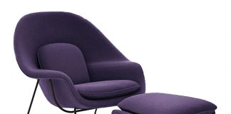 A purple chair and footstool.