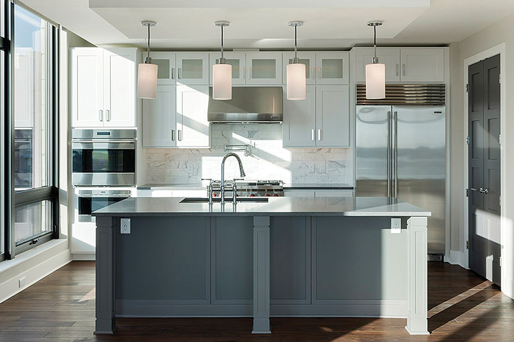 A modern kitchen in a room at The Lakes Lakefront Residences in Minneapolis, part of Midwest Home's Luxury Loft and Condo Tour.