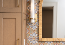 lake harriet bathroom with wallpaper and gold accents