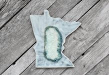 Locally crafted from stoneware ceramic clay, the Minnesota State Geode Glass Handmade Trivet from Dock 6 Pottery adds a touch of artistry—and a dash of state pride—to any table.