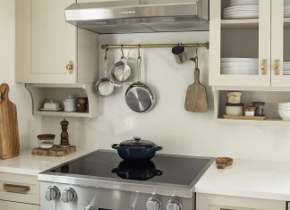 A cottage-style kitchen with thoughtful detailing and floating shelves from Revival House.