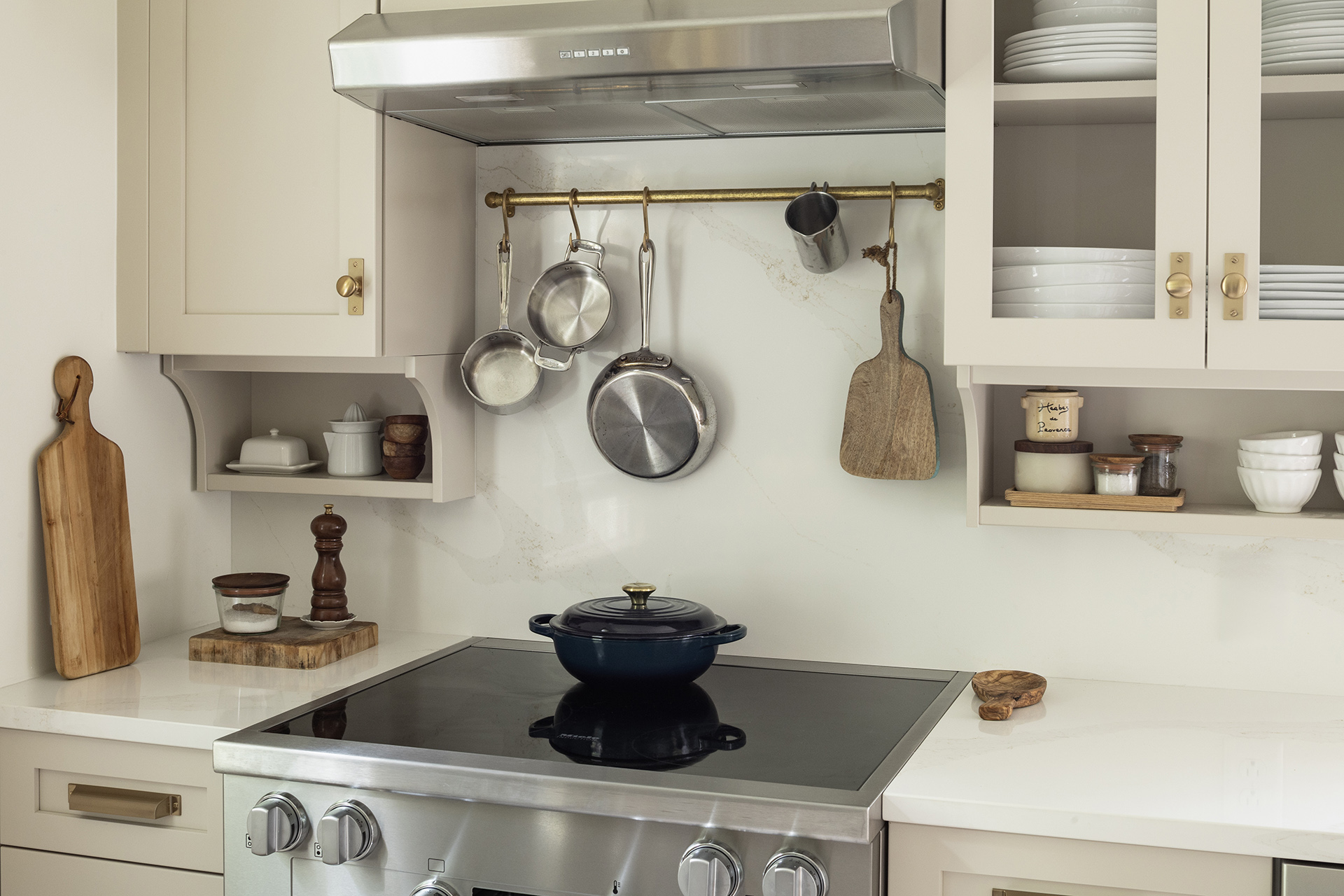 A cottage-style kitchen with thoughtful detailing and floating shelves from Revival House.