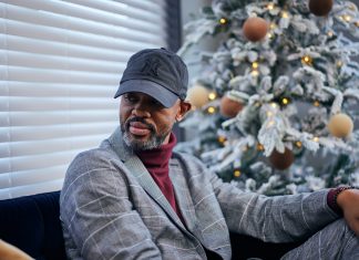 Houston White is pictured in the living room of one of the units in Camdentown Flats, his latest housing development project in North Minneapolis.
