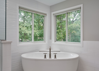 open-concept-shower-and-large-white-soaking-tub-in-corner-of-windows