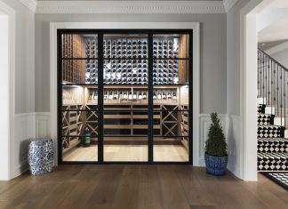 A butler's pantry was transformed into an impressive wine room that helps display and store a collection of nearly 1,000 bottles.