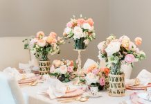 Varying heights and vessels add visual interest to floral arrangements at the dining table