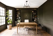 This home office by Willaby Way features Roycroft Bronze Green by Sherwin Williams to color drench the walls, millwork, and cabinetry.