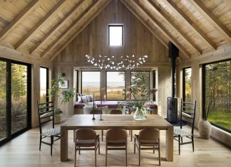 The day bed in the bay window is a pinnacle of the design and a key family gathering spot, says Penfield. It’s spacious enough for the family to sit together, cozily. While seated, they can feel immersed in nature, and the cabin’s interior fades into the landscape.